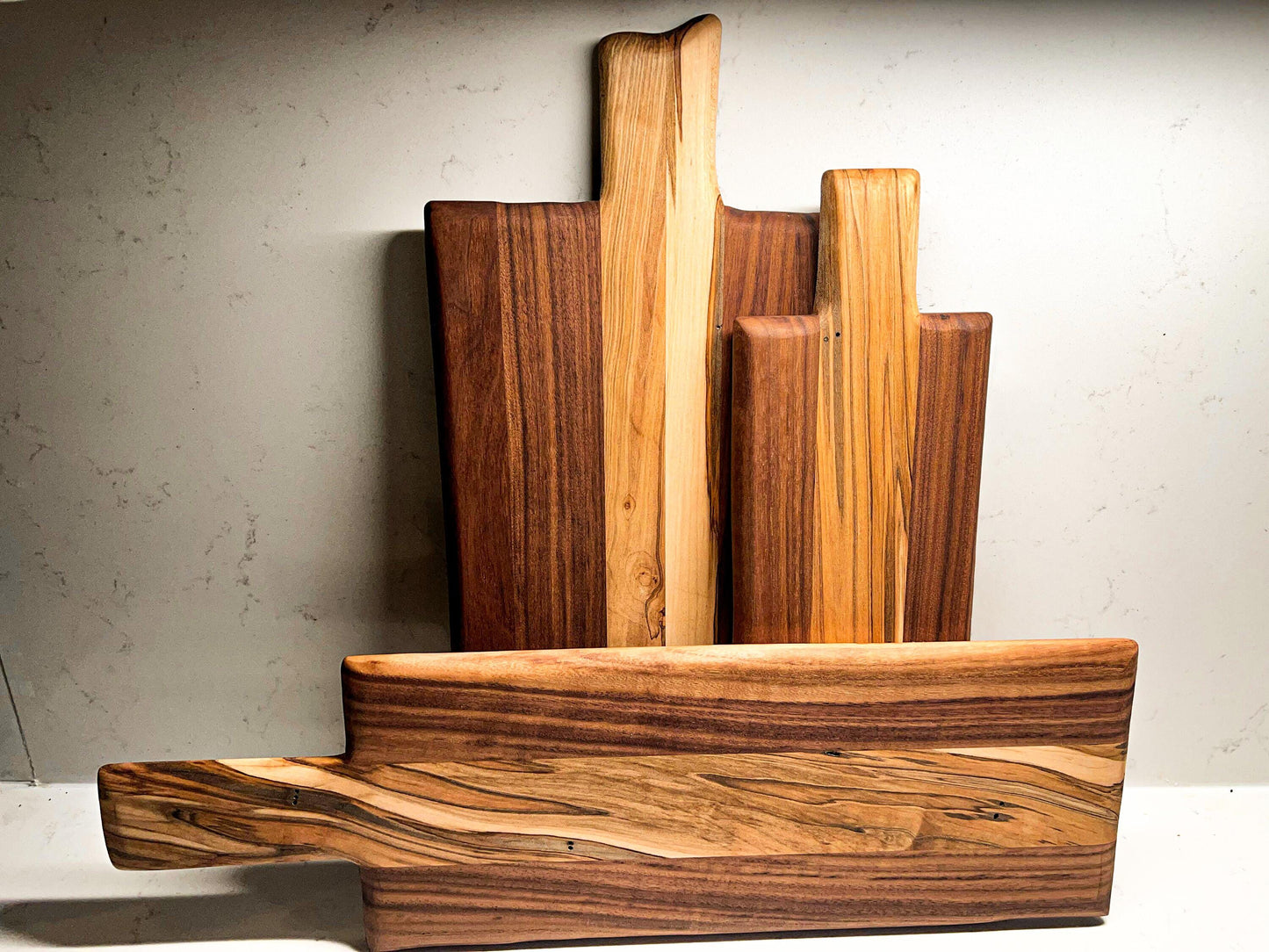 Walnut charcuterie board with maple accents