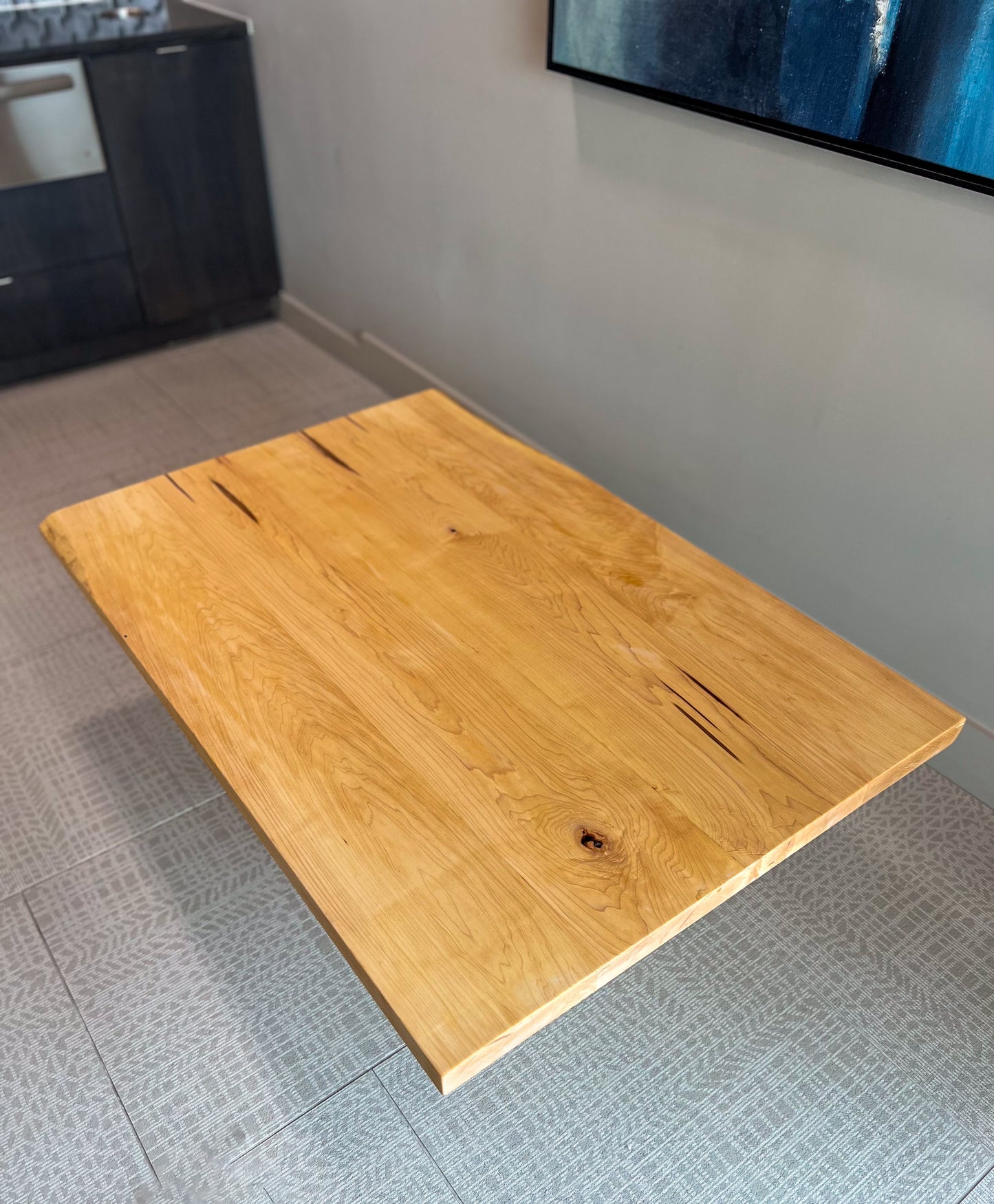 Handcrafted Japanese floor table made from solid wood with a live edge design. A low dining table perfect for tea, family meals, or modern spaces. Sustainable, custom-made furniture from Austin, Texas with timeless artisan style.