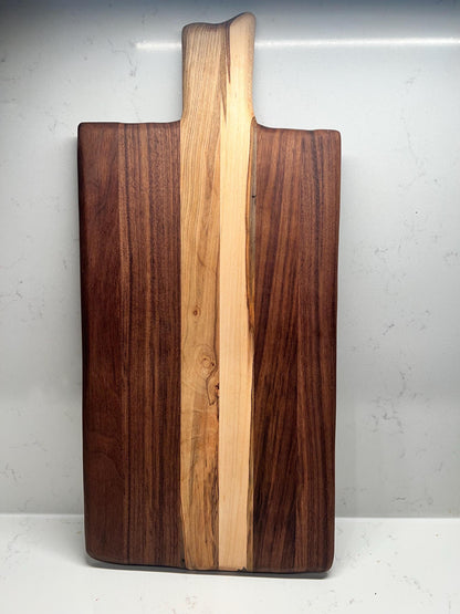 Walnut charcuterie board with maple accents